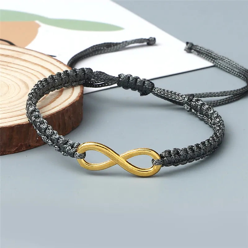 Bracciale Intrecciato Handmade con Charm Infinito – Regolabile