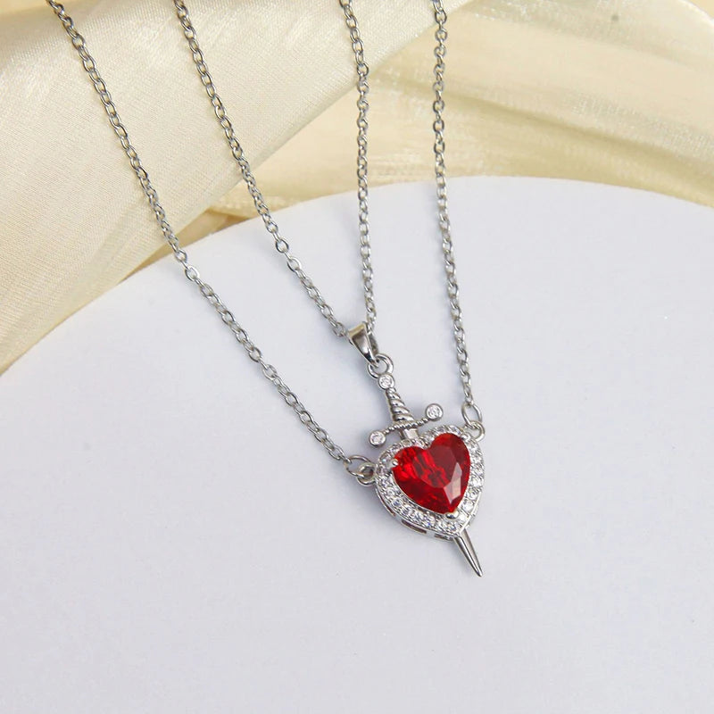 Collane Coppia Cuore & Spada 2025 – Set Argento/Oro con Zirconi